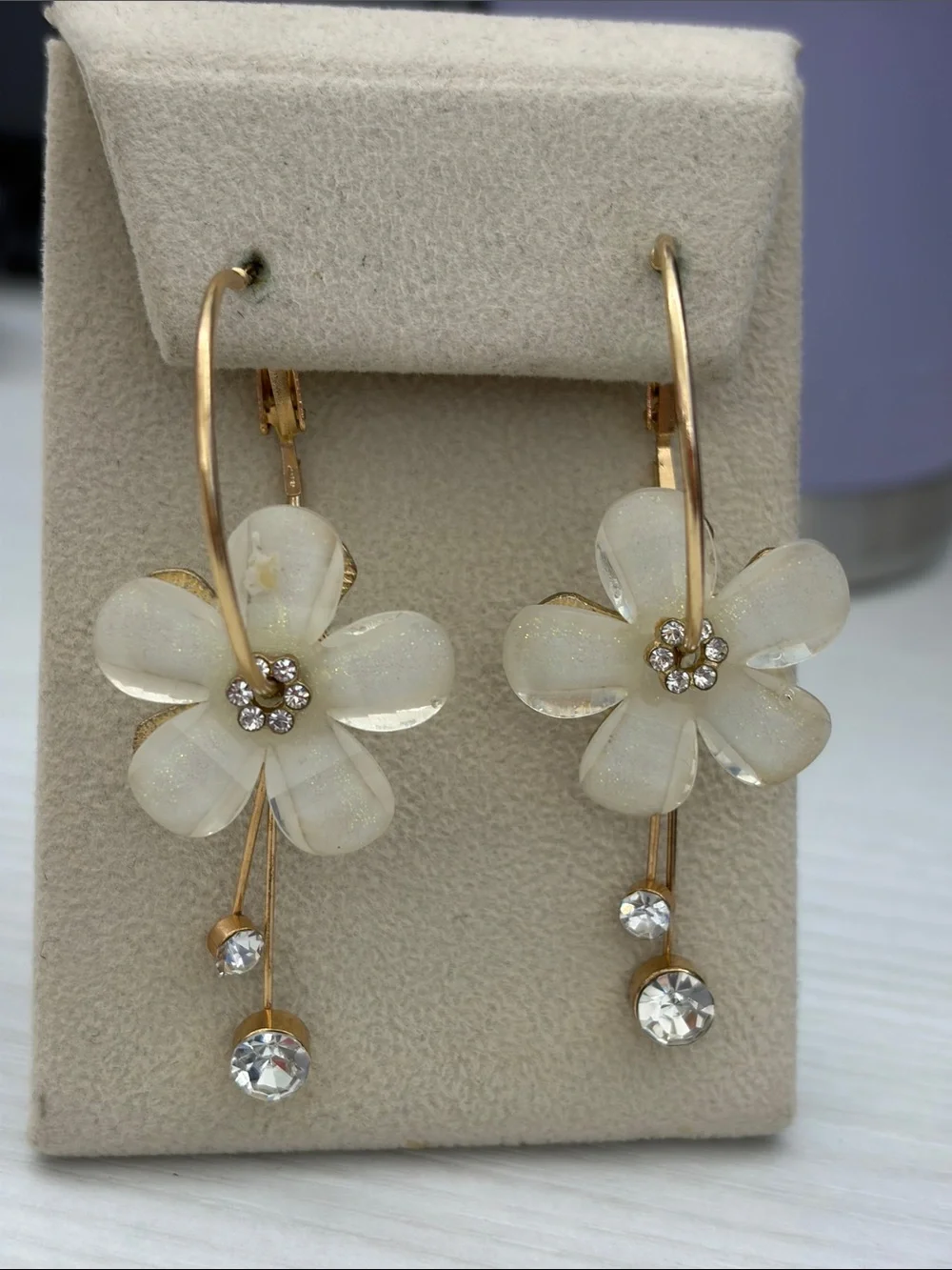 Gold Hoop Earrings with White Flower Drops and Crystal Accents